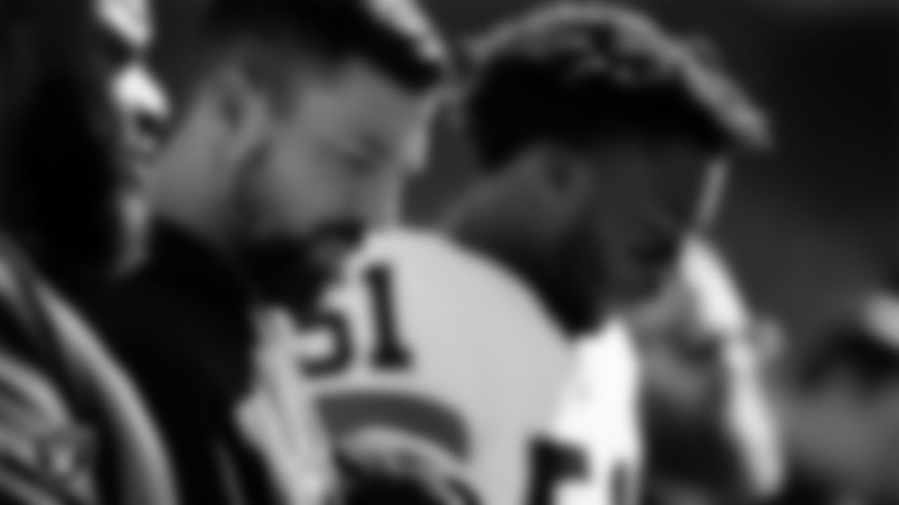 Las Vegas Raiders run game coordinator/defensive line coach Rob Leonard during the national anthem before the regular season away game against the Kansas City Chiefs at GEHA Field at Arrowhead Stadium.