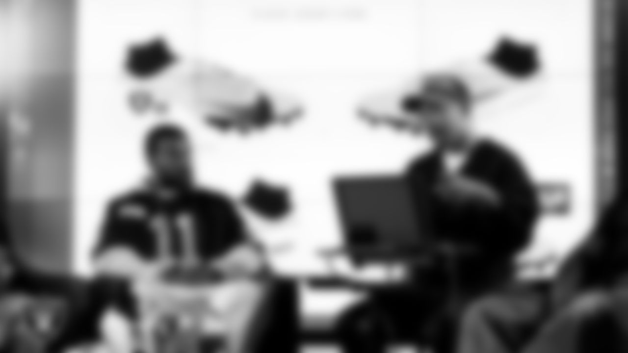 Las Vegas Raiders safety Jeremy Chinn (11) works with representatives from the Raiders Silver & Black League and designers to design cleats for My Cause My Cleats in Cox Studios at Intermountain Health Performance Center.