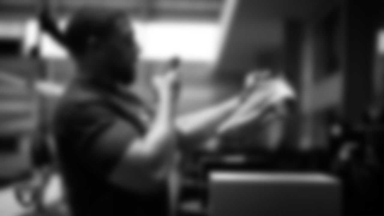 Las Vegas Raiders defensive tackle Thomas Booker IV (99) unboxes his custom cleats for the NFL's My Cause My Cleats initiative at Intermountain Health Performance Center.