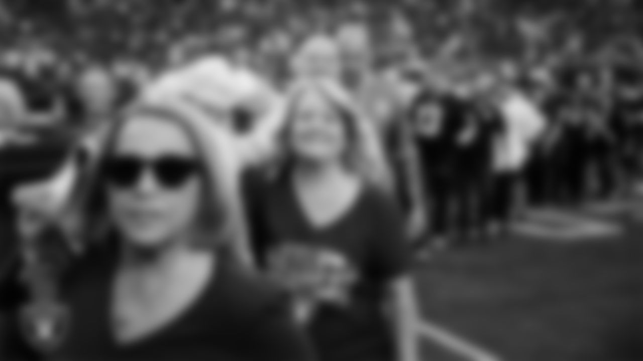 The American flag is displayed by Personal Seat License (PSL) holders on the field during the national anthem before the Las Vegas Raiders' regular season home game against the Jacksonville Jaguars at Allegiant Stadium.