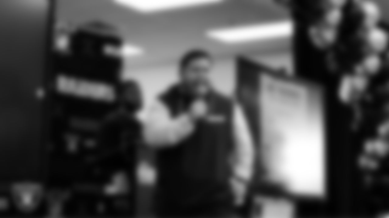 Las Vegas Raiders senior manager of football development Jordan Aguilar hypes up students during a Raiders Spirit Day at Richard H. Bryan Elementary School.