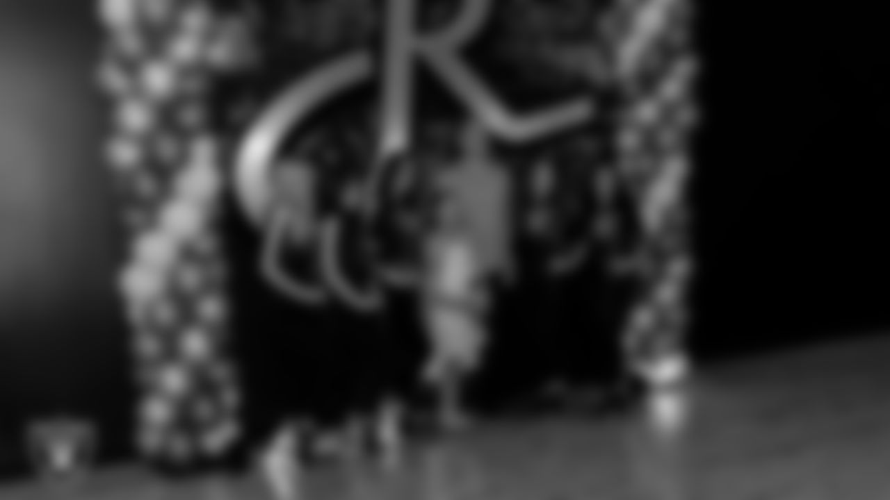 Raiderettes Delaney, Ashtin, Reagan, Lexie and Kylee pose for a photo with attendees during the Valentine's Day Dance at The Studio.