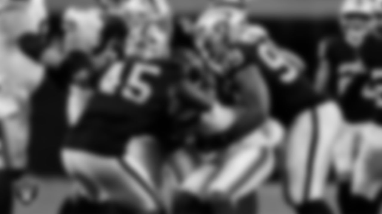 Las Vegas Raiders linebacker Devin White (45) and defensive tackle Thomas Booker IV (99) during the regular season home game against the New York Giants at Allegiant Stadium.