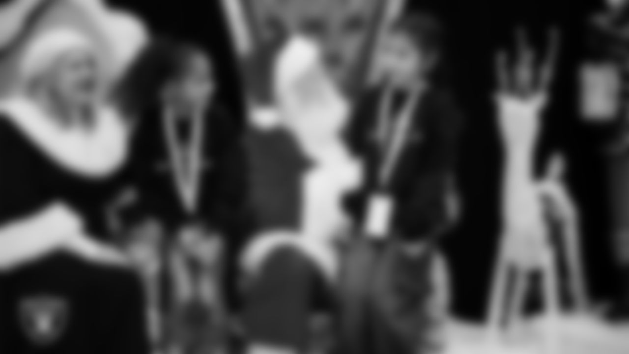 Students visit with Mrs. Claus and Santa during a Raiders Youth Holiday Party at Intermountain Health Performance Center.