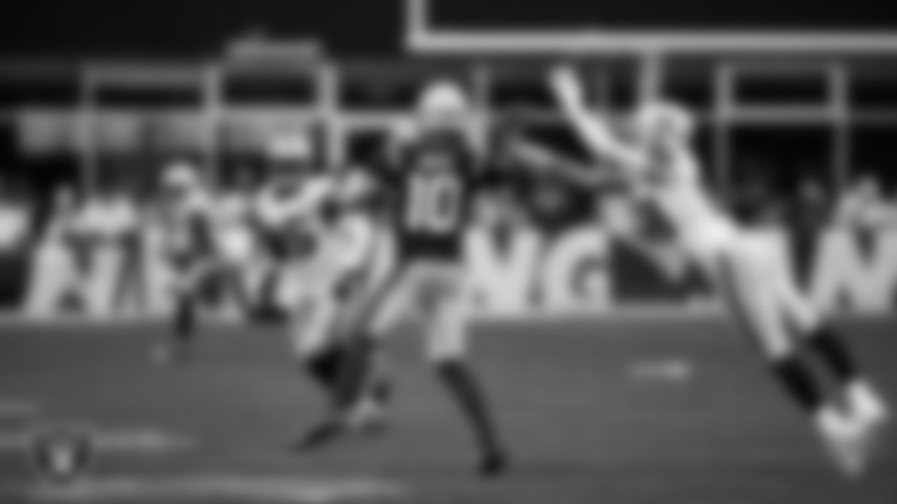 Las Vegas Raiders defensive end Maxx Crosby (98) pressures the quarterback during the regular season away game against the New England Patriots at Gillette Stadium.