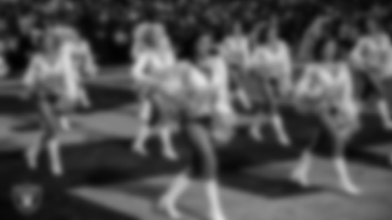 Raiderette Kylee walks onto the field for a performance during the regular season home game against the New York Giants at Allegiant Stadium.