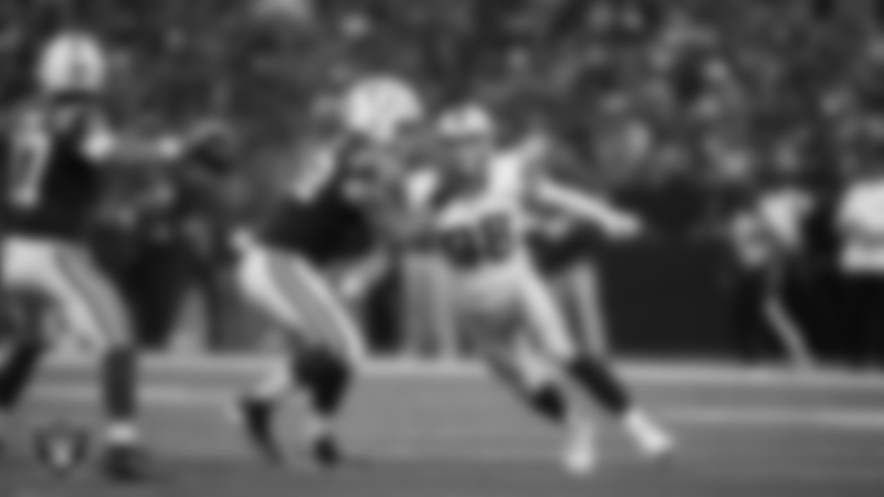 Las Vegas Raiders defensive end Maxx Crosby (98) pressures the quarterback during the regular season away game against the Indianapolis Colts at Lucas Oil Stadium.