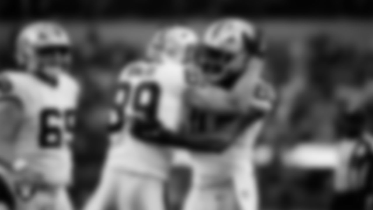 Las Vegas Raiders tight end Brock Bowers (89) celebrates with tight end Ian Thomas (80) after making a 6-yard touchdown catch during the regular season away game against the Los Angeles Chargers at SoFi Stadium.