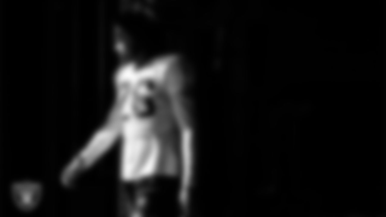 Las Vegas Raiders cornerback Darien Porter (26) walks out to the field for practice at Intermountain Health Performance Center.