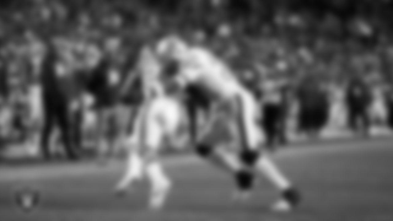 Las Vegas Raiders linebacker Jamal Adams (33) makes a tackle during the regular season away game against the Denver Broncos at Empower Field at Mile High.