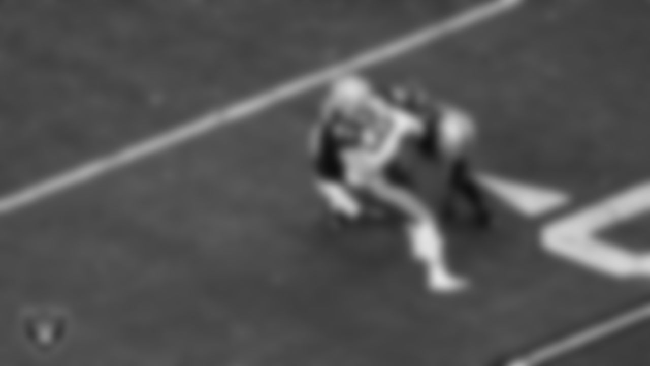 Las Vegas Raiders linebacker Tommy Eichenberg (44) and cornerback Eric Stokes (22) make a tackle during the regular season home game against the Kansas City Chiefs at Allegiant Stadium.