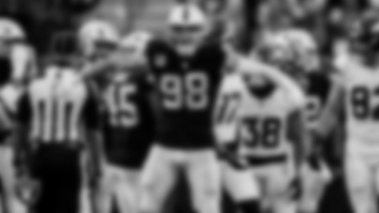 Las Vegas Raiders defensive end Maxx Crosby (98) celebrates after making a tackle during the regular season home game against the Denver Broncos at Allegiant Stadium.