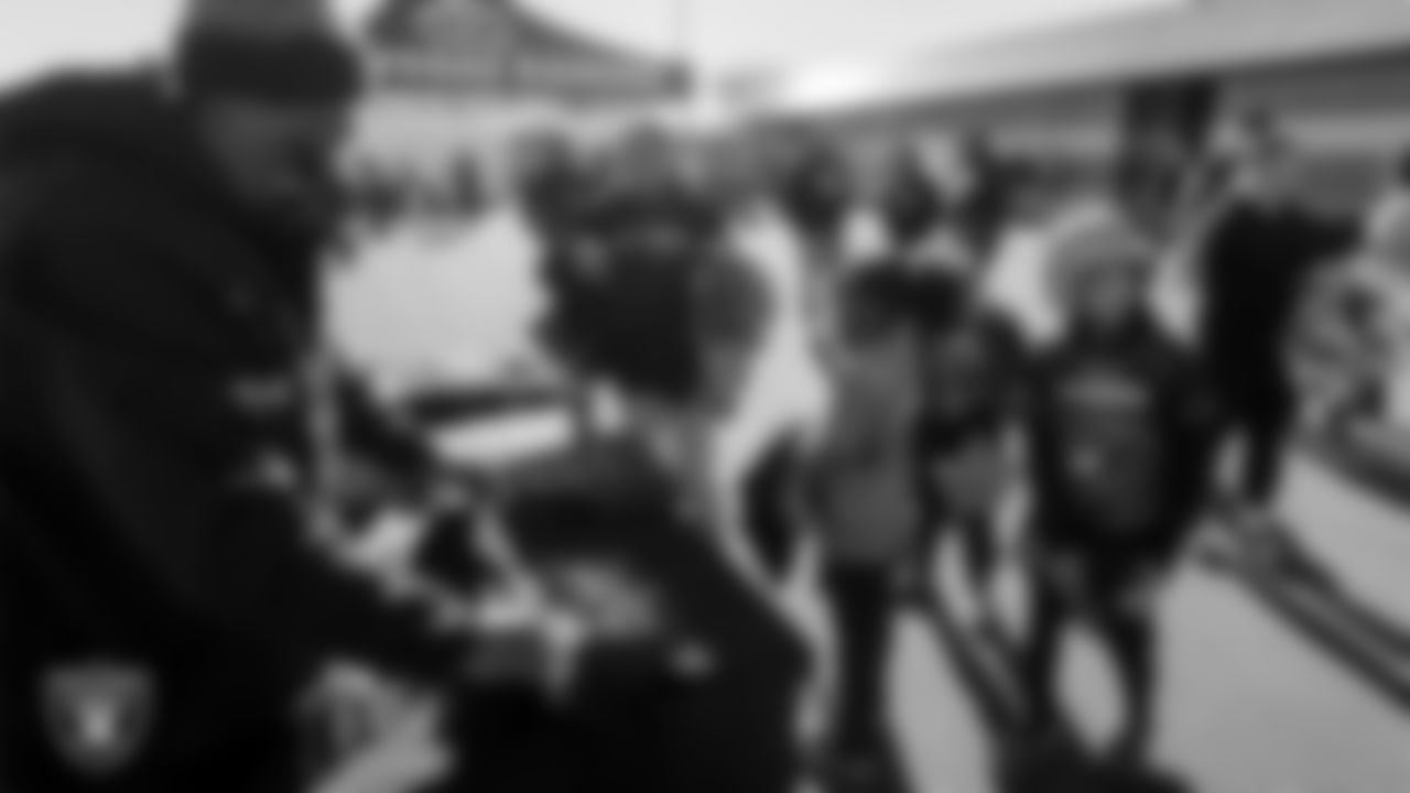 Attendees receive Las Vegas Raiders gear during Silver and Black Saturday at Liberty High School.