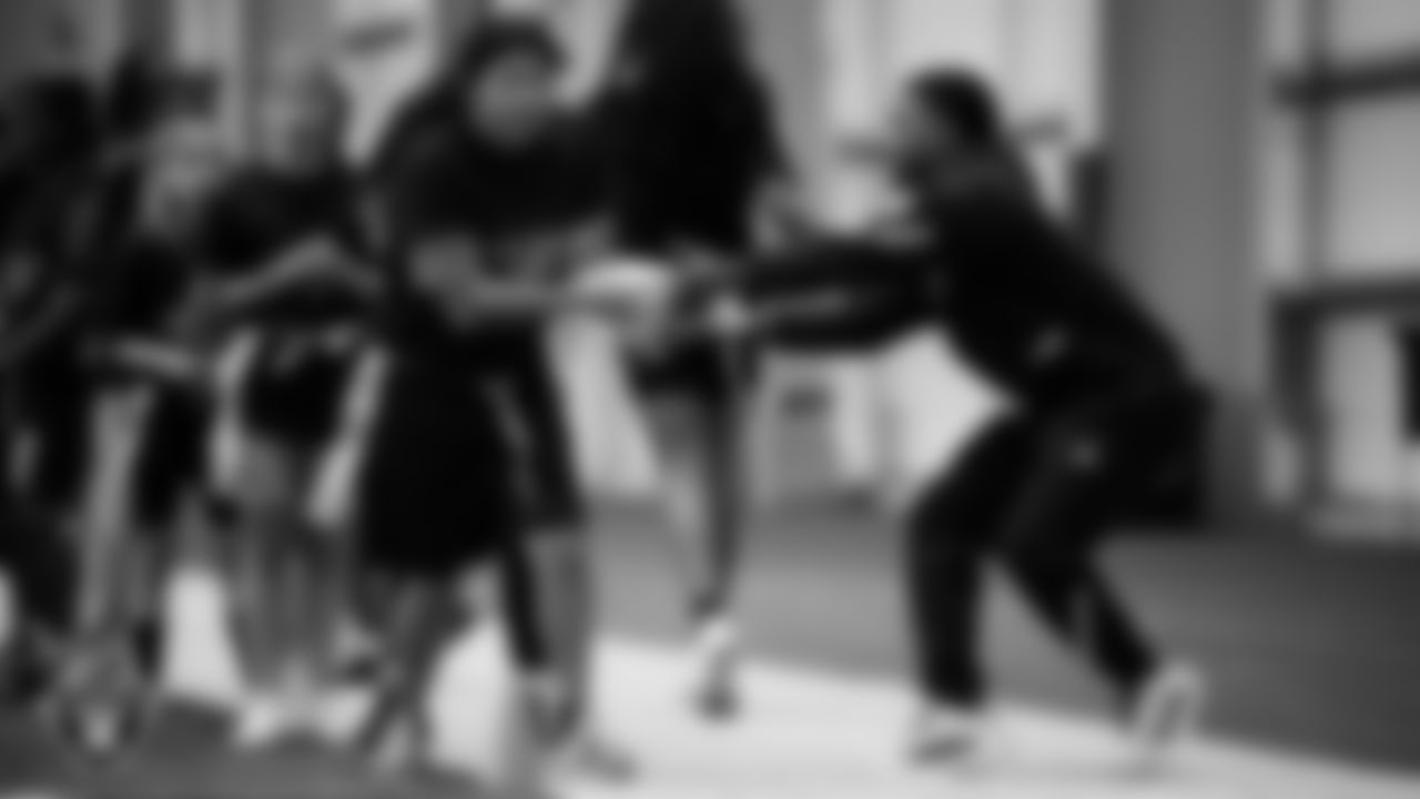 A member of the Grambling State University football team helps on a drill during a Raiders Junior Training Camp at Intermountain Health Performance Center.