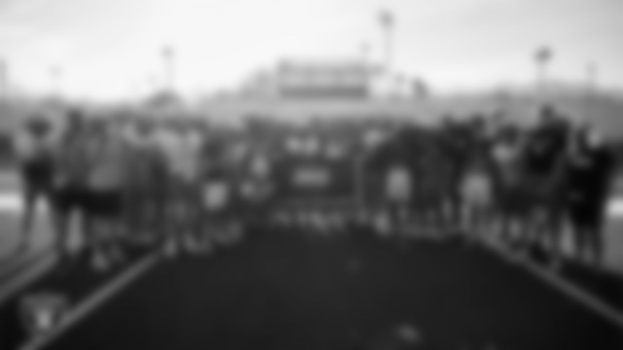 The Faith Lutheran High School football team poses for a photo during practice at Faith Lutheran High School.