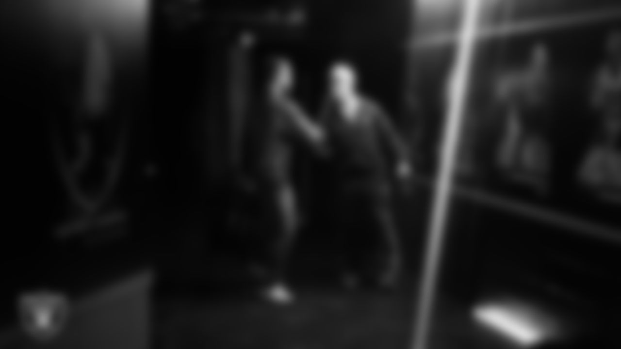 Las Vegas Raiders linebacker Jon Rhattigan (59) and running back Dylan Laube (23) arrive to the regular season home game against the Kansas City Chiefs at Allegiant Stadium.