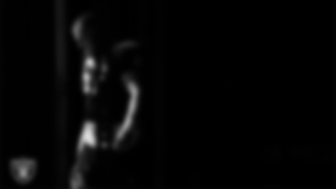 Las Vegas Raiders center Will Putnam (67) walks out to the field for practice at Intermountain Health Performance Center.