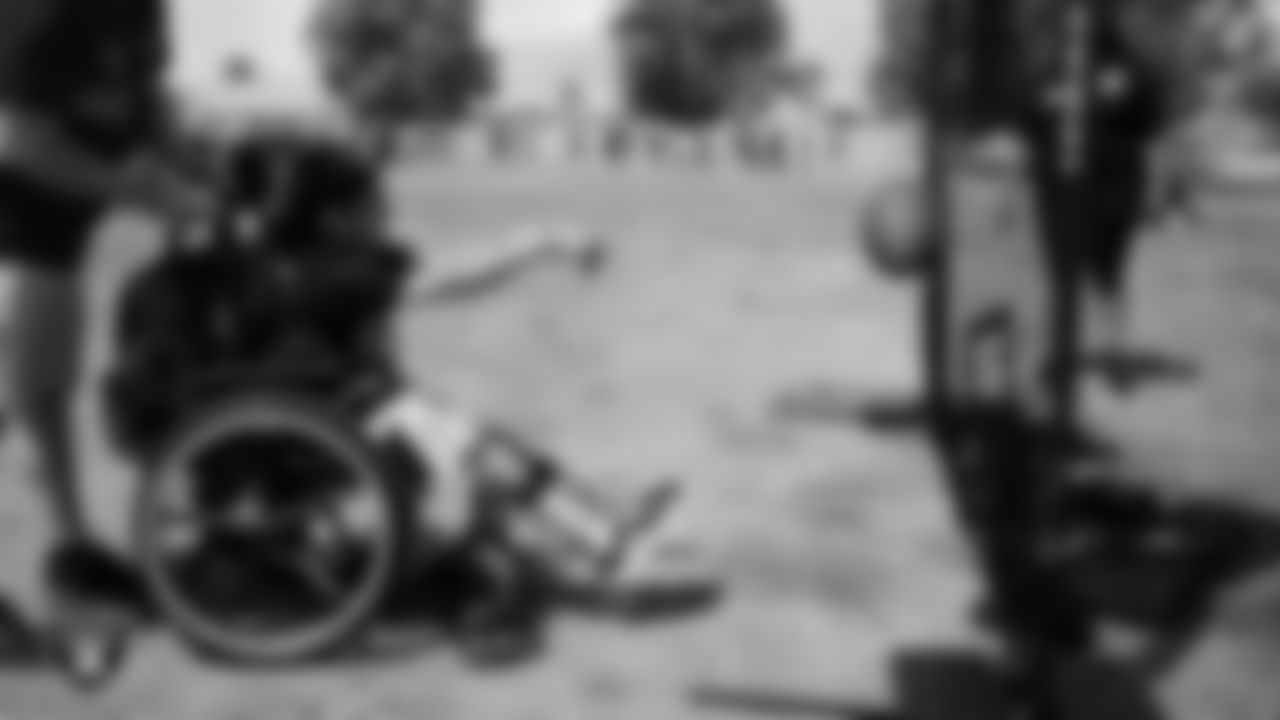 A student goes through a drill during a Raiders Junior Training Camp at Berkeley Bunker Elementary School.