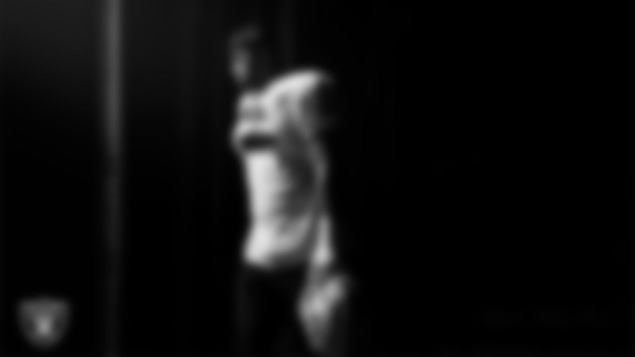 Las Vegas Raiders defensive tackle Jonah Laulu (96) walks out to the field for practice at Intermountain Health Performance Center.