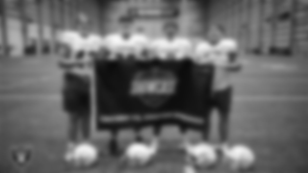 Members of the Carson High School football team pose for a photo during a walkthrough at Intermountain Health Performance Center.