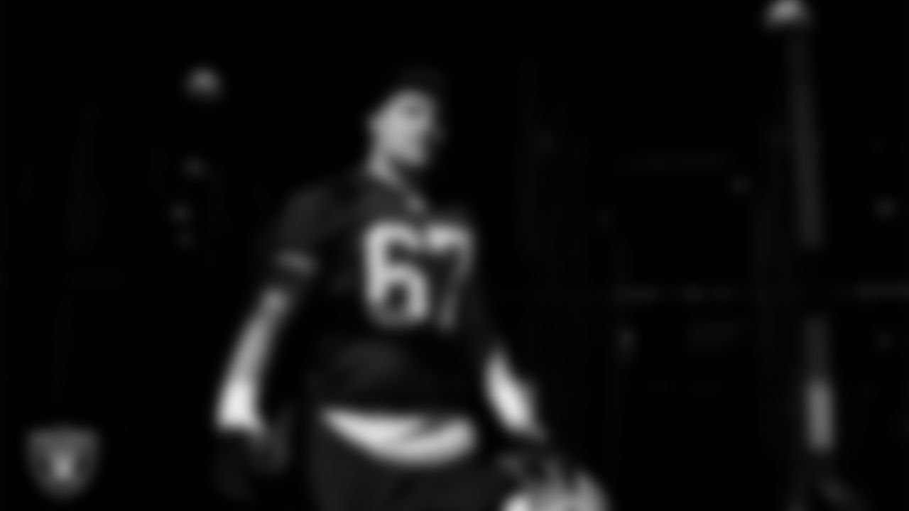 Las Vegas Raiders center Will Putnam (67) walks out to the field for practice at Intermountain Health Performance Center.