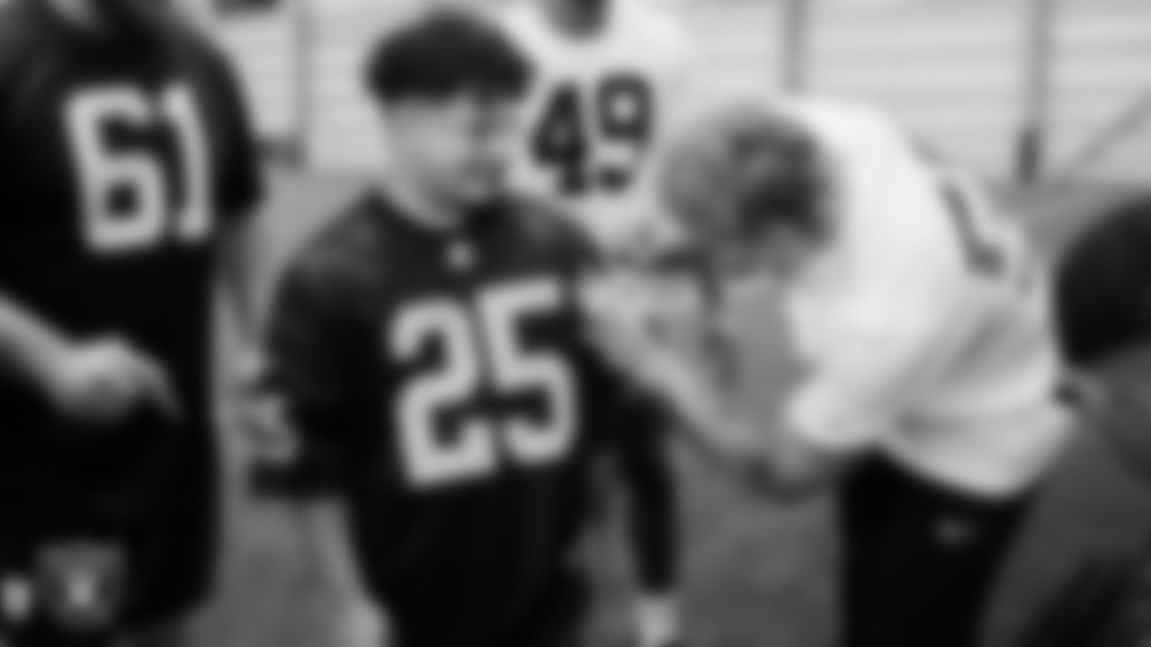 Marcos Carrillo from Make-A-Wish gets his jersey signed after practice during a visit to Intermountain Health Performance Center.