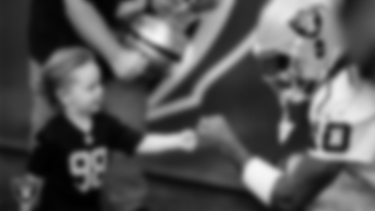 Las Vegas Raiders wide receiver Dont'e Thornton Jr. (10) with a fan before the regular season away game against the Houston Texans at NRG Stadium.