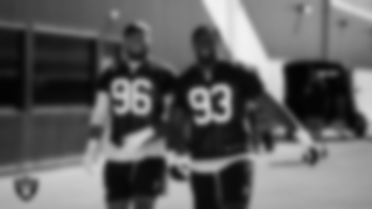 Las Vegas Raiders defensive tackle Jonah Laulu (96) and defensive tackle Zach Carter (93) at a workout during phase two of the offseason program at Intermountain Health Performance Center.