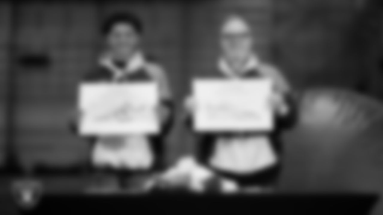 Intermountain Health Regional President Mitch Cloward and Intermountain Children's Health patient Aiden show off their My Cause My Cleats custom shoes design at Intermountain Health Performance Center.