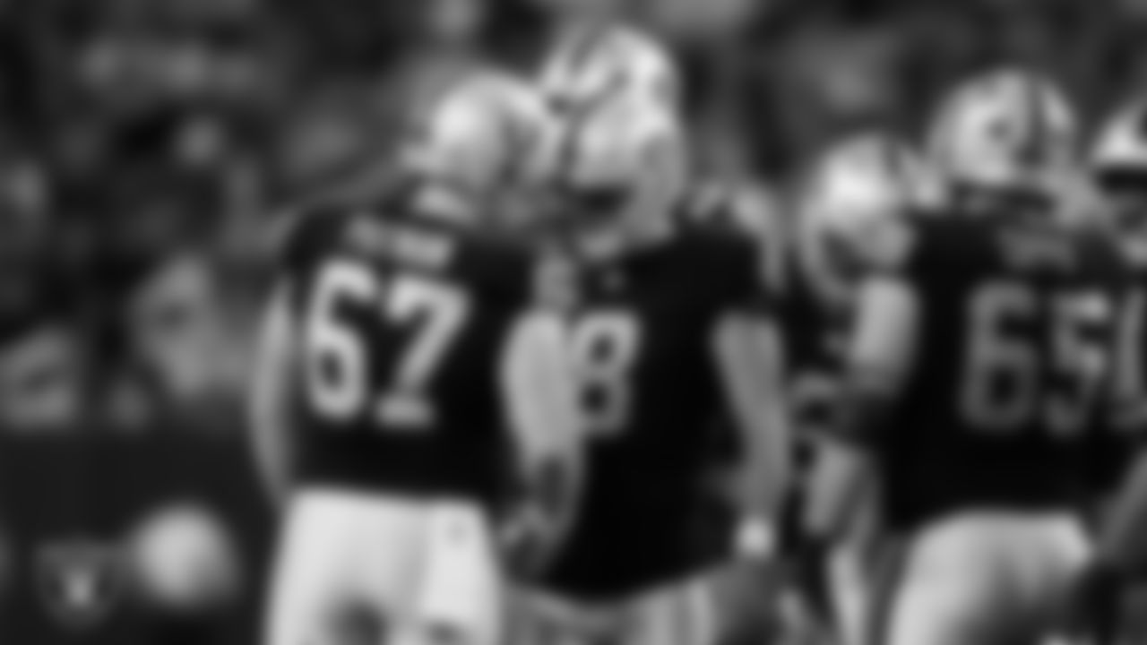 Las Vegas Raiders kicker Daniel Carlson (8) celebrates with center Will Putnam (67) after kicking a 40-yard field goal during the regular season home game against the Los Angeles Chargers at Allegiant Stadium.