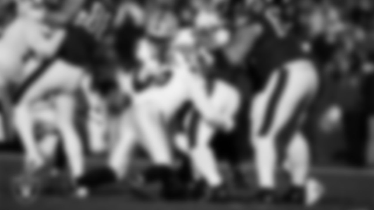 Las Vegas Raiders defensive end Charles Snowden (49) and defensive tackle Thomas Booker IV (99) make a tackle during the regular season away game against the Philadelphia Eagles at Lincoln Financial Field.