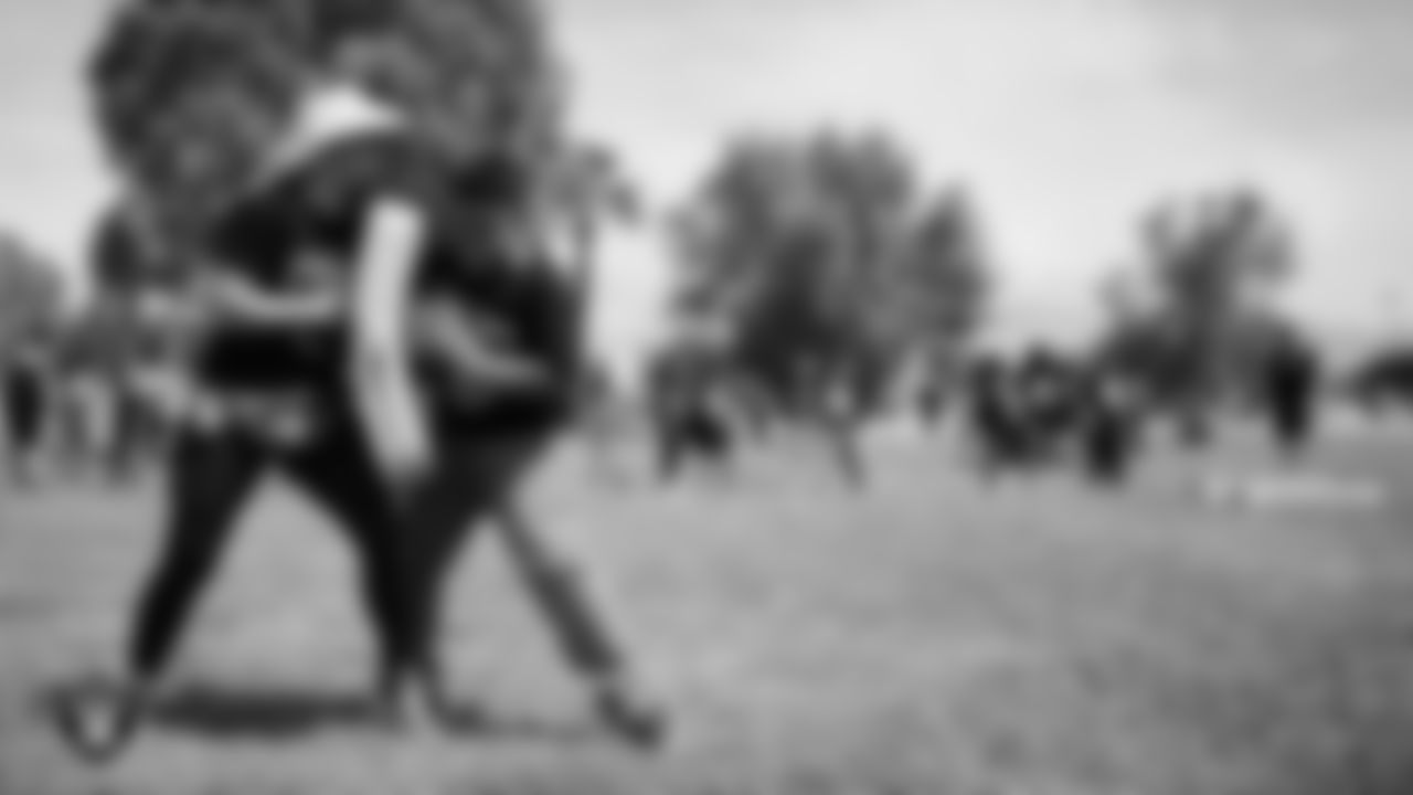 A student goes through a drill during a Raiders Junior Training Camp at Berkeley Bunker Elementary School.