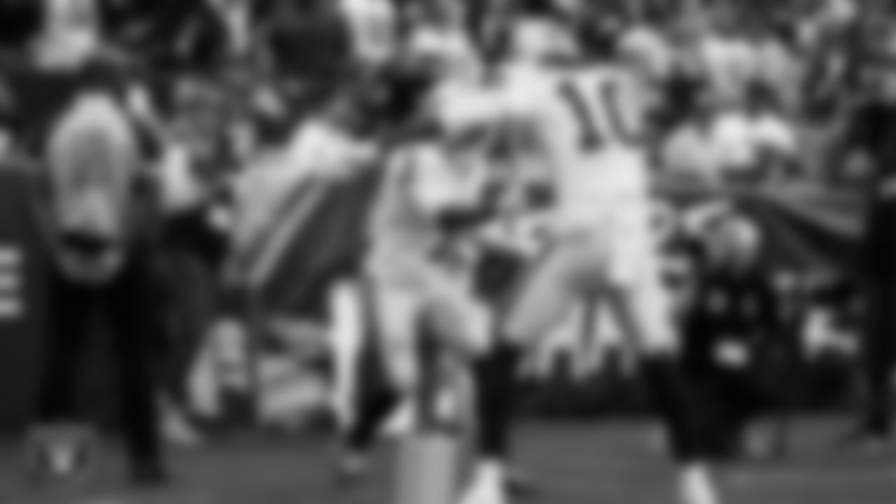 Las Vegas Raiders wide receiver Tre Tucker (1) celebrates with wide receiver Dont'e Thornton Jr. (10) after making a 10-yard touchdown catch during the regular season away game against the Washington Commanders at Northwest Stadium.