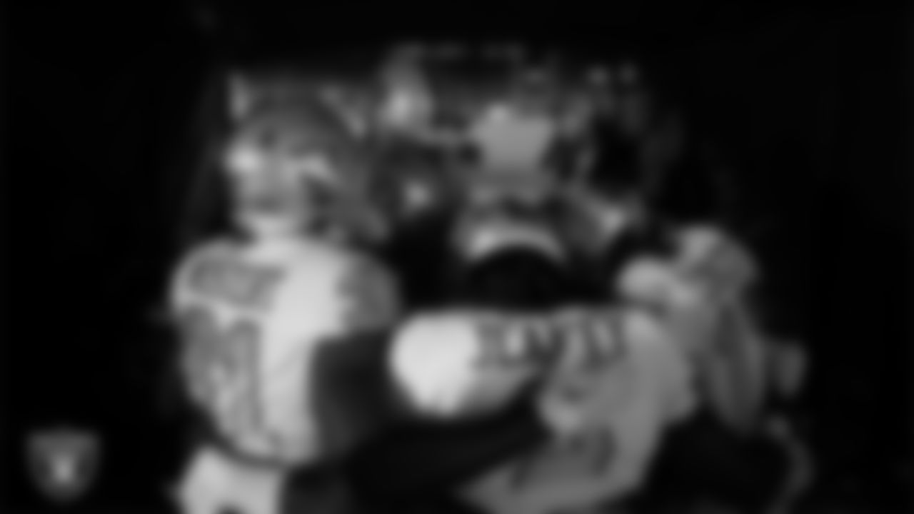 The Las Vegas Raiders returners huddle in the tunnel before the regular season away game against the Denver Broncos at Empower Field at Mile High.