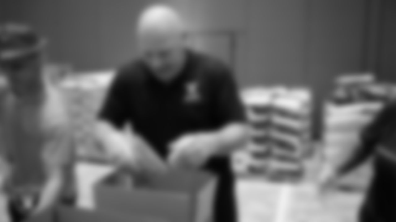 Las Vegas Raiders alumnus Jay Schroeder packs meals during a Feed the Funnel Party at Wynn Las Vegas.