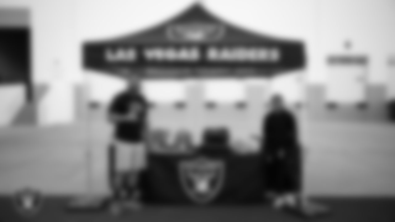 Las Vegas Raiders manager of football development Marli Bartlett poses for a photo with Womens7 Football League founder Talamoni Toatasimana during the football development equipment giveaway at Las Vegas Raiders Headquarters.