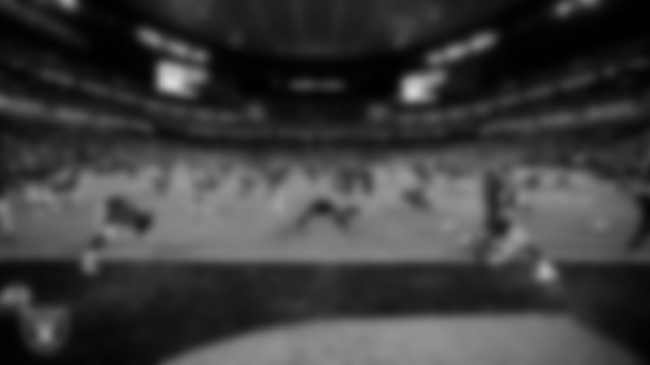 The Las Vegas Raiders warming up before the regular season home game against the Dallas Cowboys at Allegiant Stadium.