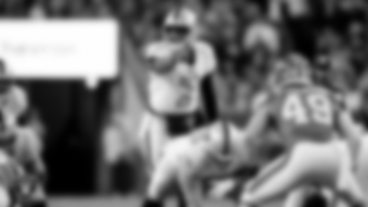 Las Vegas Raiders quarterback Geno Smith (7) during the regular season away game against the Denver Broncos at Empower Field at Mile High.