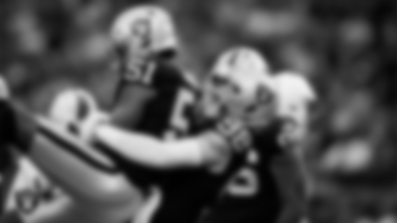 Las Vegas Raiders defensive end Malcolm Koonce (51) celebrates with defensive end Maxx Crosby (98) after sacking the quarterback during the regular season home game against the Cleveland Browns at Allegiant Stadium.