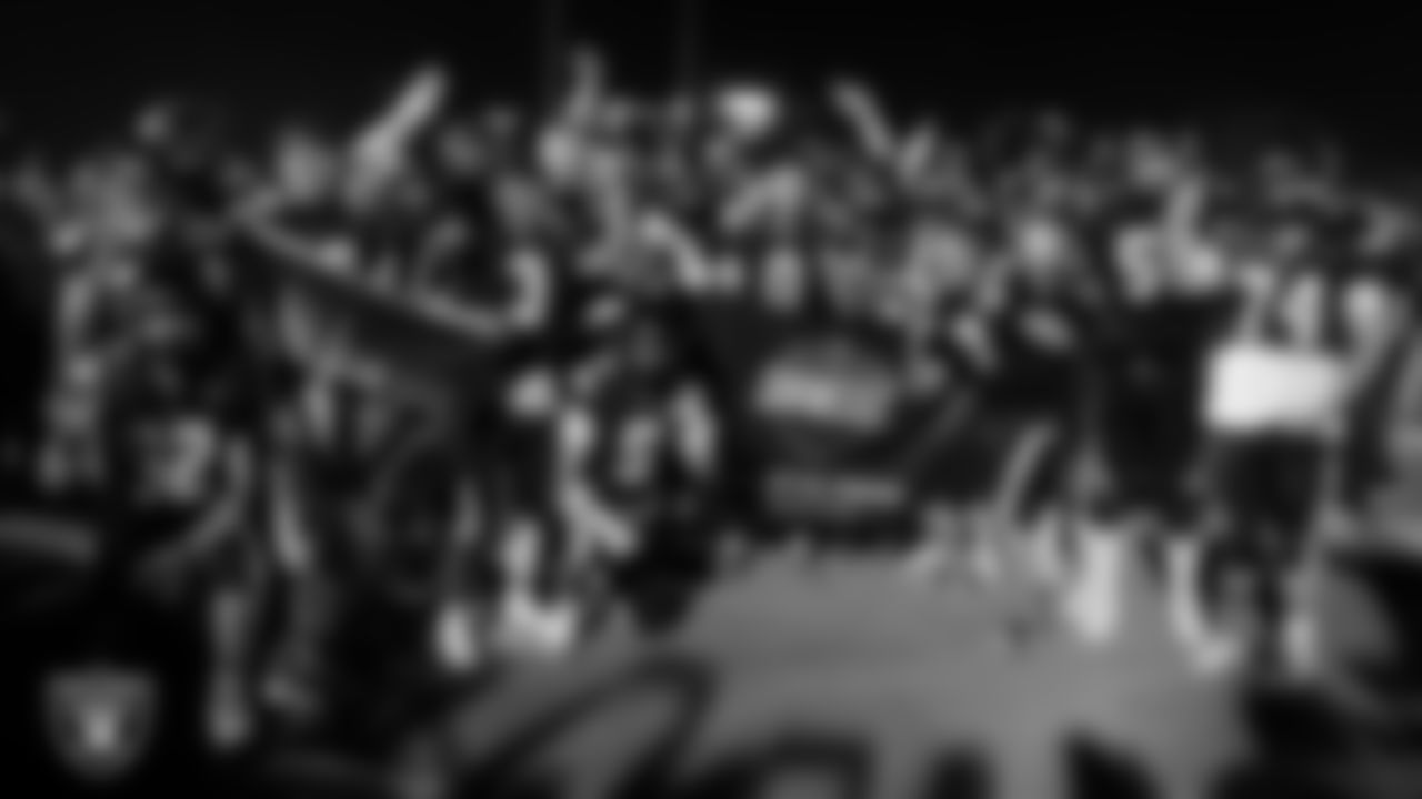 The Virgin Valley High School football team poses for a photo after the Las Vegas Raiders' Football Showcase game at Moapa Valley High School.