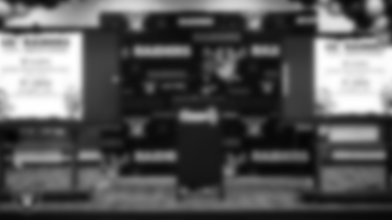 Las Vegas Raiders coordinator of football development Chris Shelby speaks to students during a Raiders Spirit Day at Richard H. Bryan Elementary School.