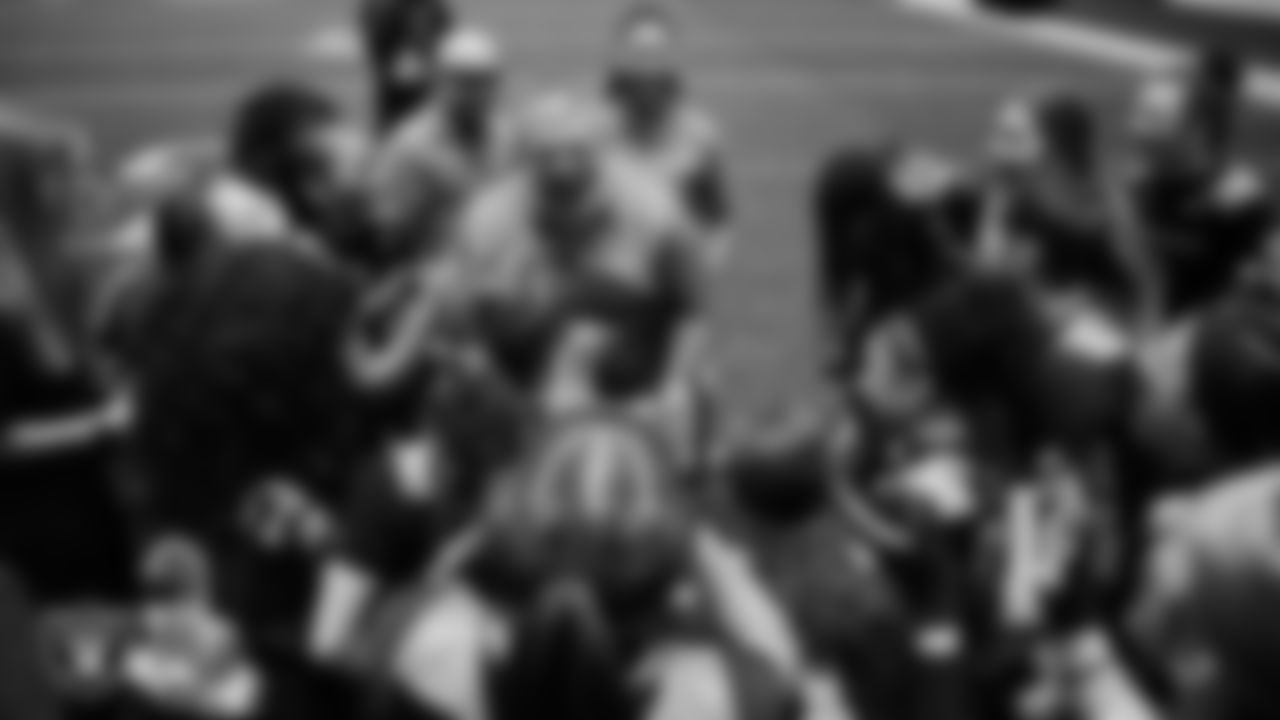 The Nevada State University flag football team celebrates after winning the inaugural women's flag football game at Intermountain Health Performance Center.