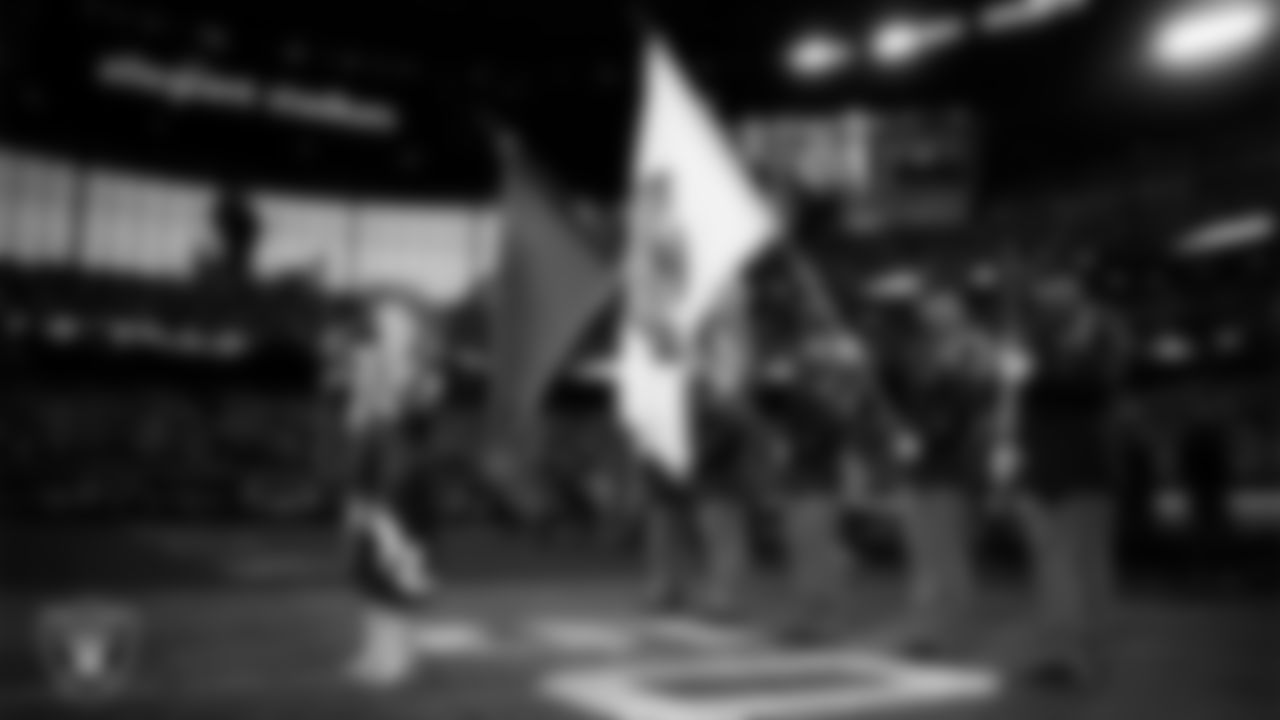 Singer and songwriter Brooke Eden performs the national anthem while the Nevada Army National Guard presents the nation's colors before the Las Vegas Raiders' regular season home game against the Denver Broncos at Allegiant Stadium.