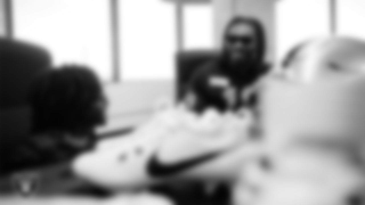 Las Vegas Raiders wide receiver DJ Turner (19) meets with representatives from the Raiders Silver & Black Flag Football league to design cleats for My Cause My Cleats at Shoe Palace Corporate Offices.