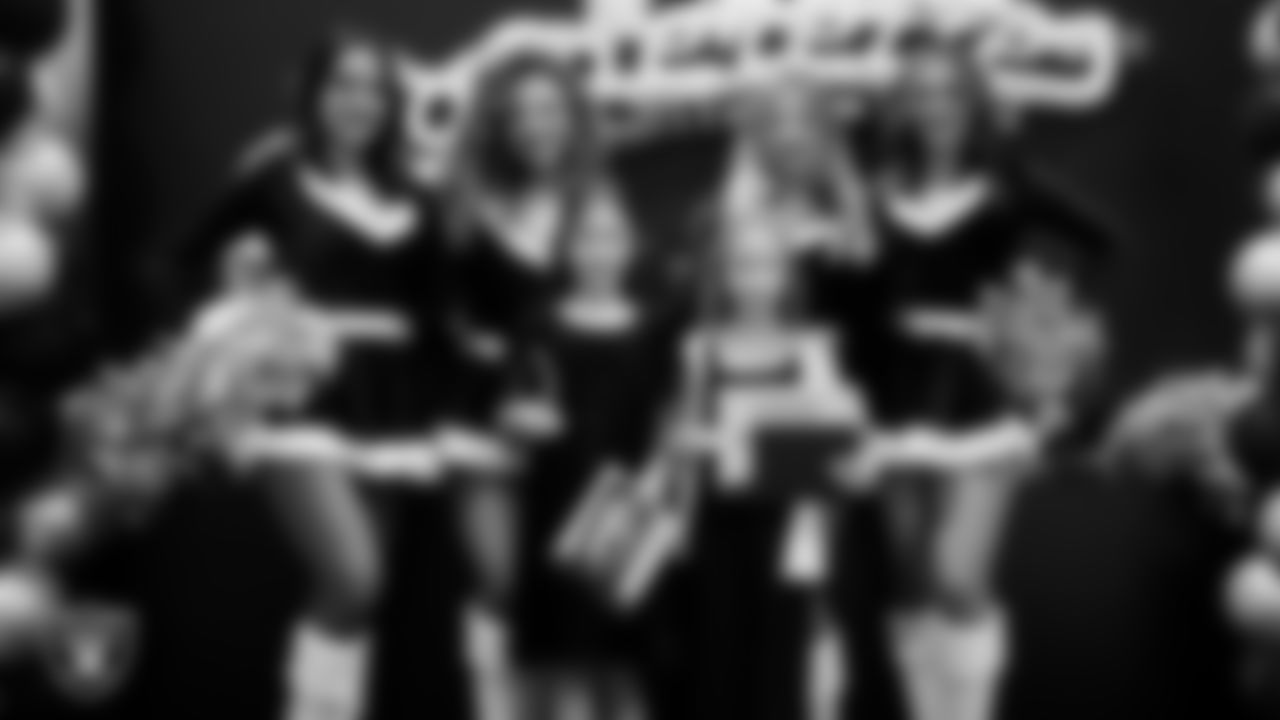 Raiderettes pose for a photo with Junior Raiderettes during the Junior Raiderettes Banquet at The Studio.