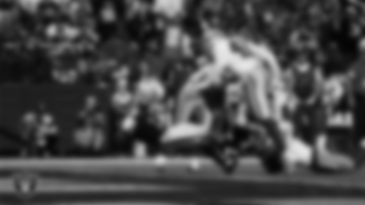 Las Vegas Raiders wide receiver Tre Tucker (1) dives into the end zone after making a 6-yard touchdown catch during the regular season home game against the Dallas Cowboys at Allegiant Stadium.