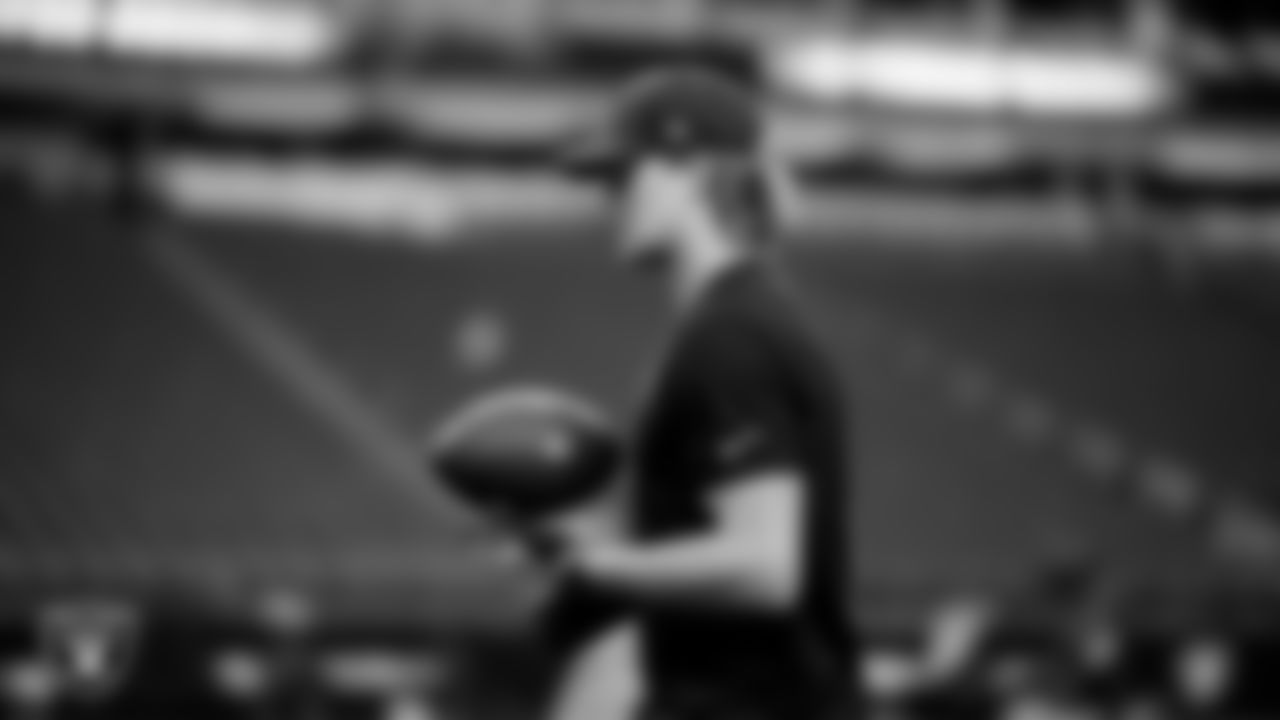 Las Vegas Raiders quarterback Kenny Pickett (15) warming up before the regular season home game against the Denver Broncos at Allegiant Stadium.