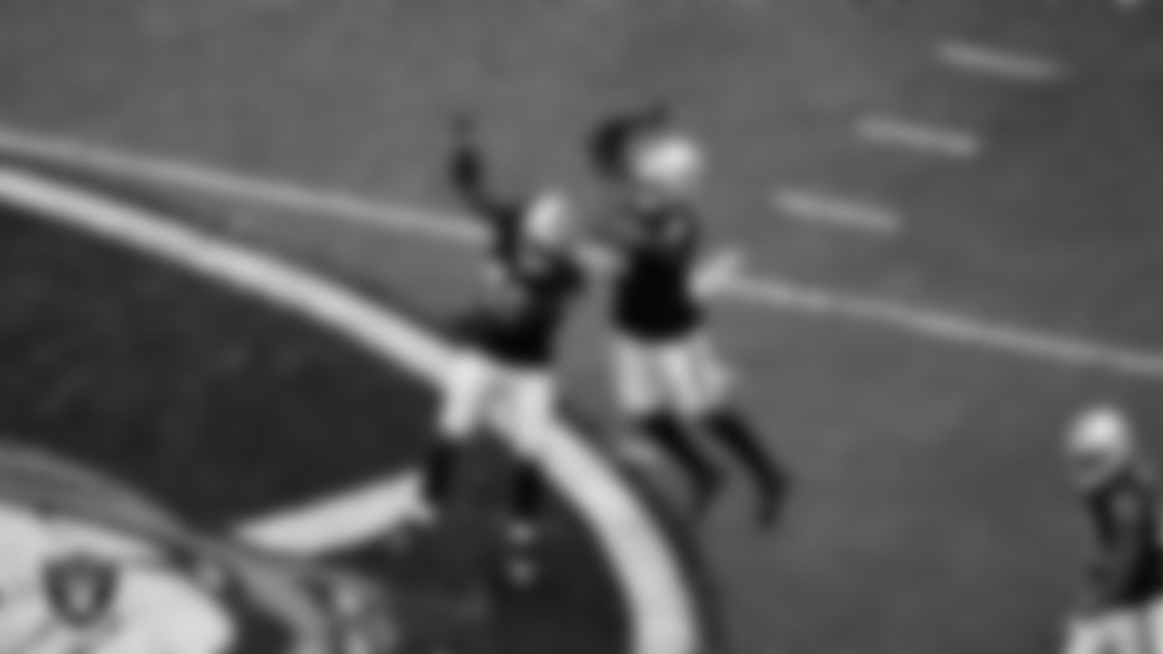 Las Vegas Raiders defensive end Tyree Wilson (9) celebrates with linebacker Devin White (45) after sacking the quarterback during the regular season home game against the Chicago Bears at Allegiant Stadium.