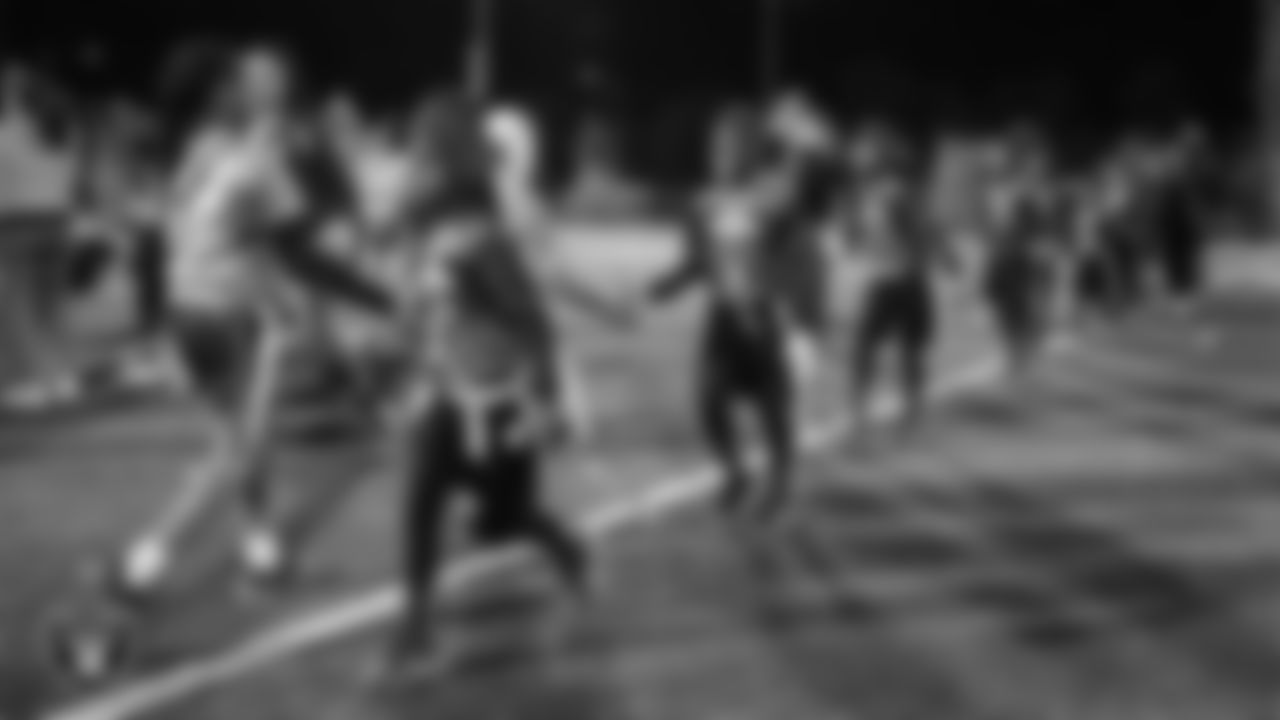 Athletes from the East Division and West Division of the City of Las Vegas Silver and Black Youth Flag Football League shake hands after the championship game at All American Park.
