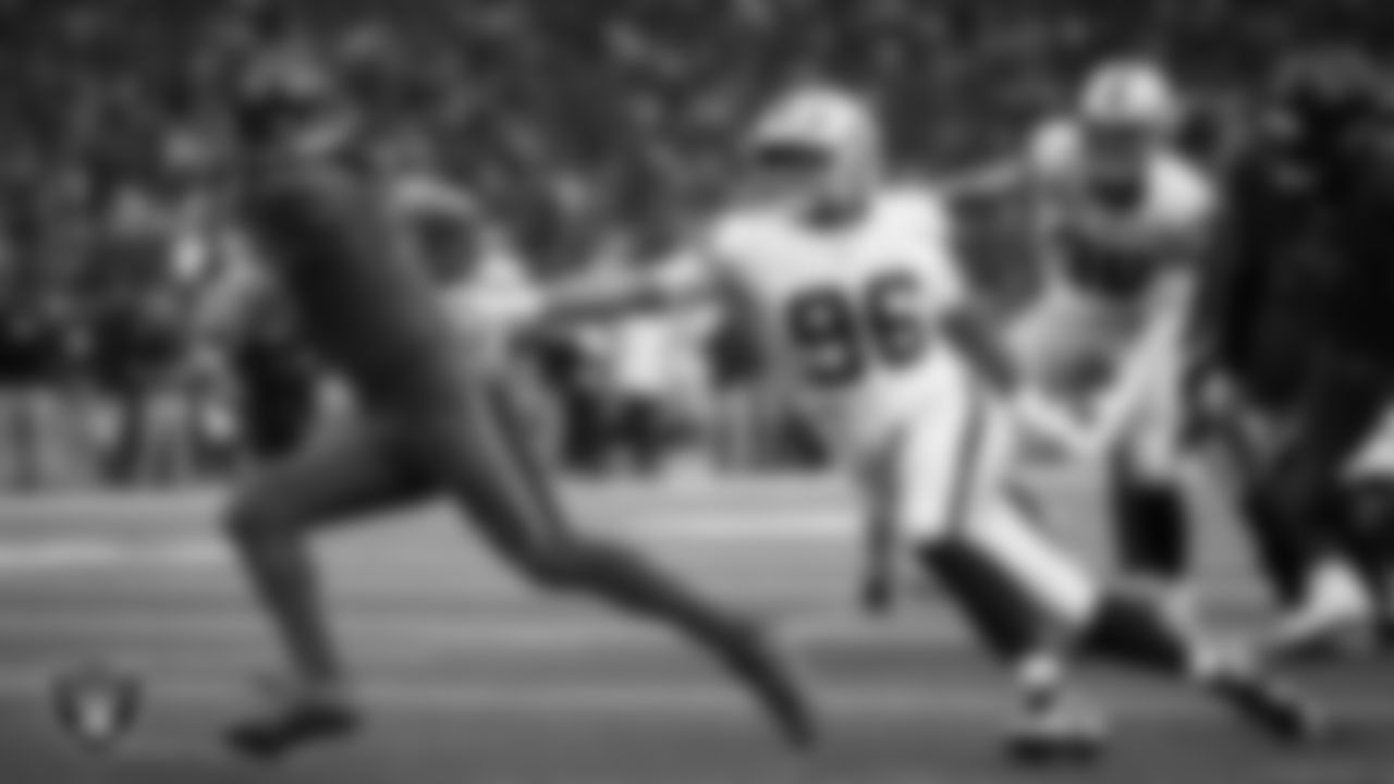 Las Vegas Raiders defensive tackle Jonah Laulu (96) pressures the quarterback during the regular season away game against the Houston Texans at NRG Stadium.